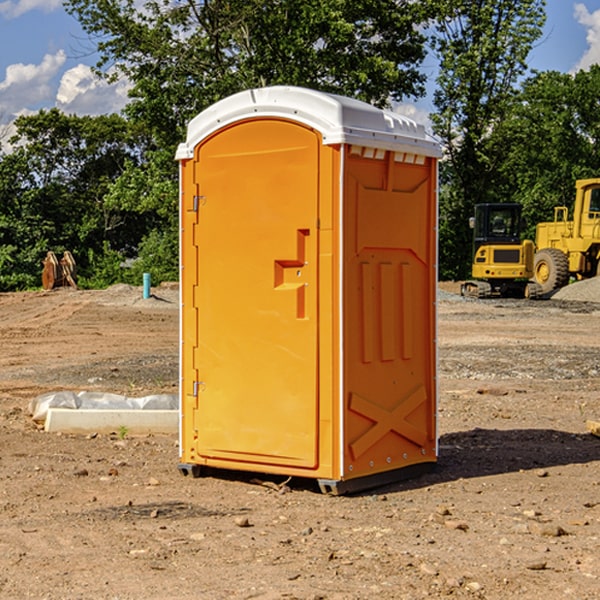 what is the cost difference between standard and deluxe portable toilet rentals in Rushville